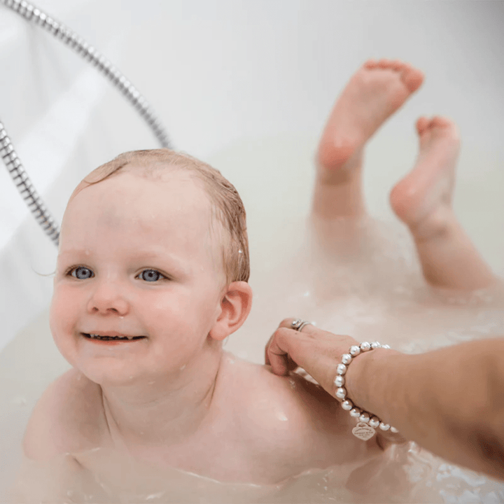 Little-Baby-Having-A-Bath-With-Haakaa-Oatmeal-Bath-Milk-In-Naked-Baby-Eco-Boutique