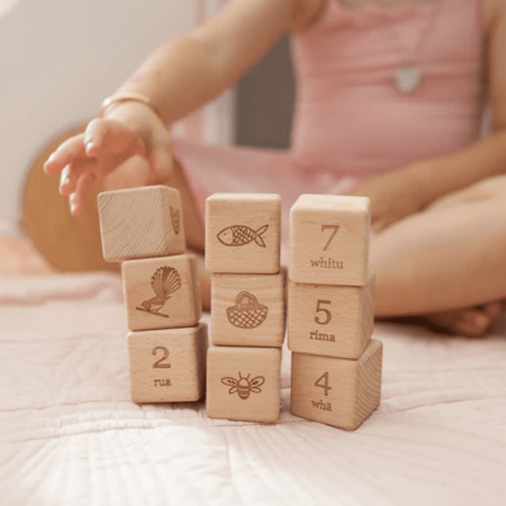 Little-Baby-Playing-With-Over-The-Dandelions-Tahi-Rua-Toru-Wooden-Block-Set-Naked-Baby-Eco-Boutique