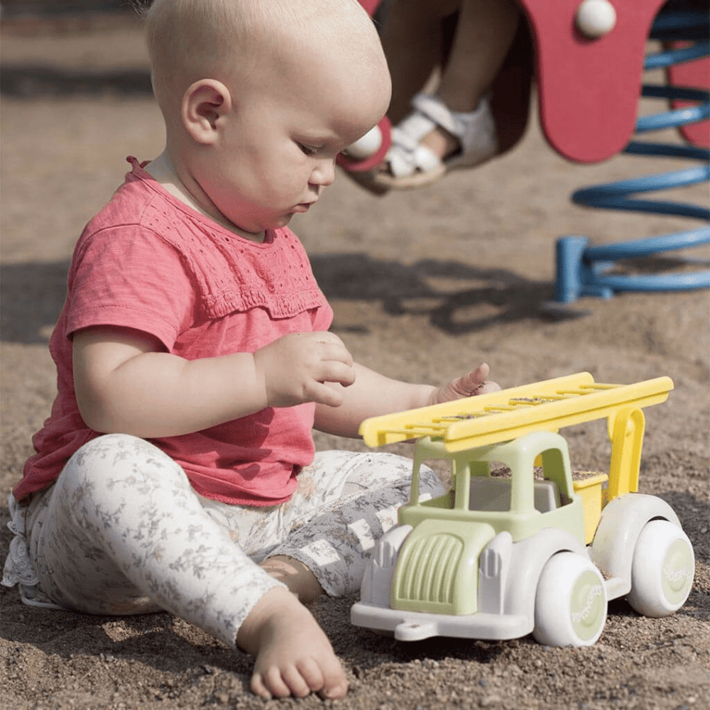 Little-Baby-Playing-With-Viking-Toys-Eco-Jumbo-Fire-Truck-Naked-Baby-Eco-Boutique