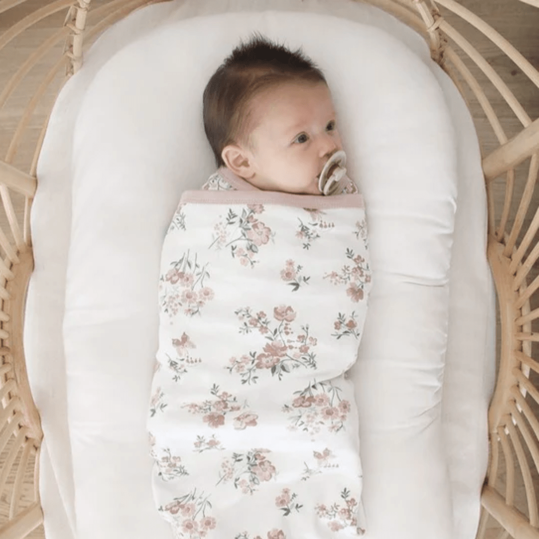 Little-Baby-Swaddled-In-Little-Baby-Lying-On-Aster-And-Oak-Organic-Cotton-Baby-Swaddle-Wrap-Primrose-Naked-Baby-Eco-Boutique