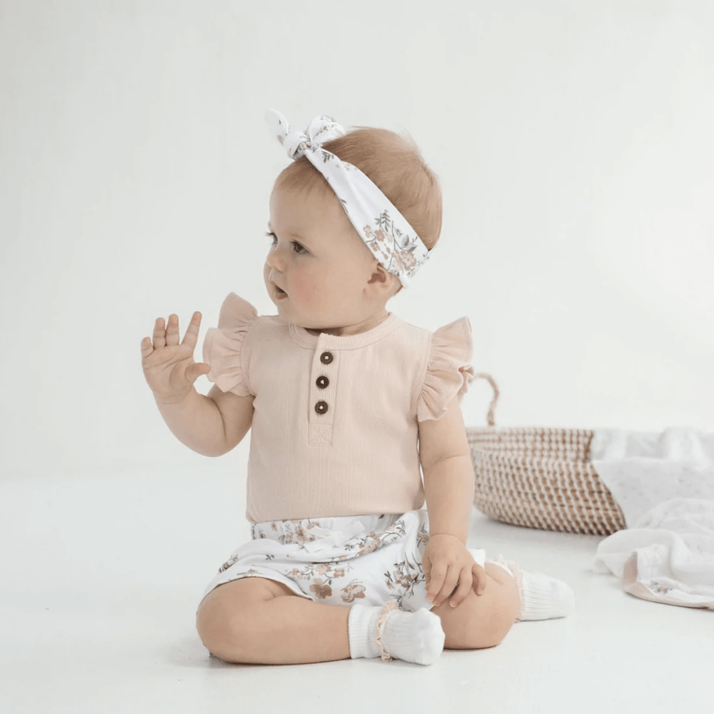 Little-Baby-Wearing-Aster-And-Oak-Organic-Peach-Rib-Ruffle-Onesie-Naked-Baby-Eco-Boutique