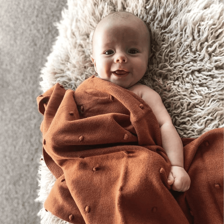 Little-Baby-With-Over-The-Dandelions-Organic-Cotton-Billie-Blanket-Burnt-Amber-Naked-Baby-Eco-Boutique