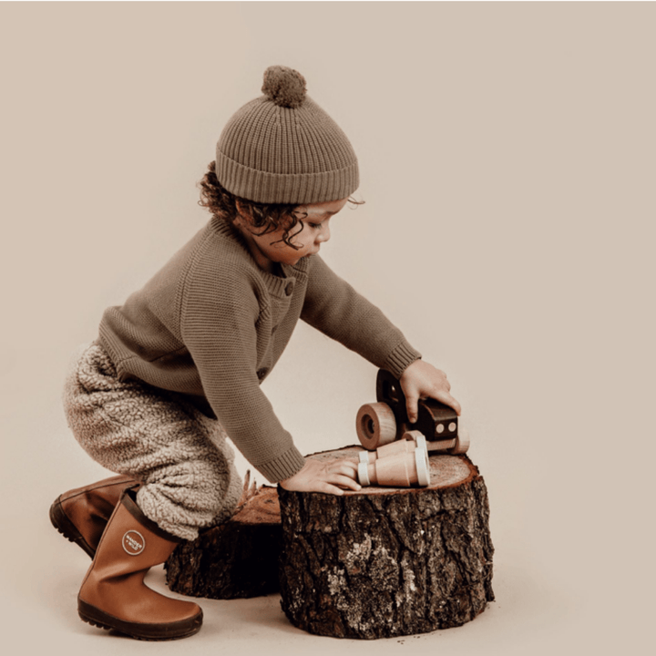 Little-Boy-Playing-Wearing-Aster-And-Oak-Organic-Chunky-Knit-Cardigan-Timber-Naked-Baby-Eco-Boutique