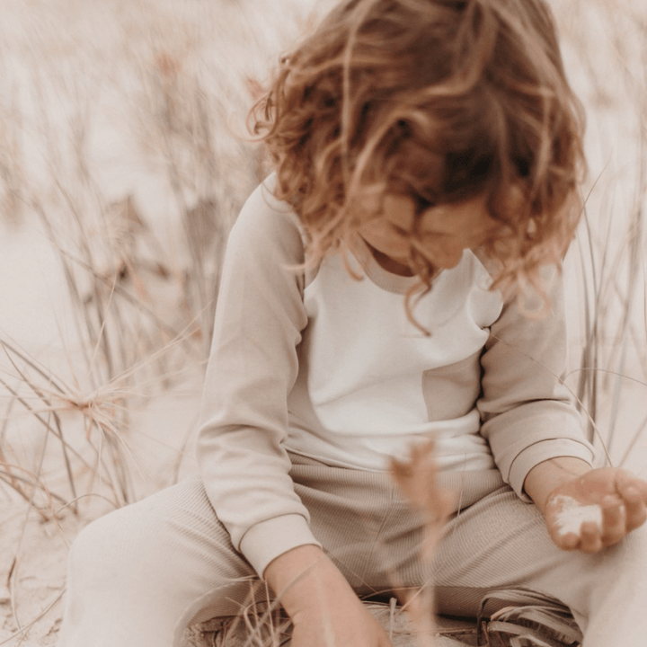 Little-Boy-Playing-in-Sand-Wearing-Aster-and-Oak-Organic-Raglan-Pocket-Tee-Naked-Baby-Eco-Boutique