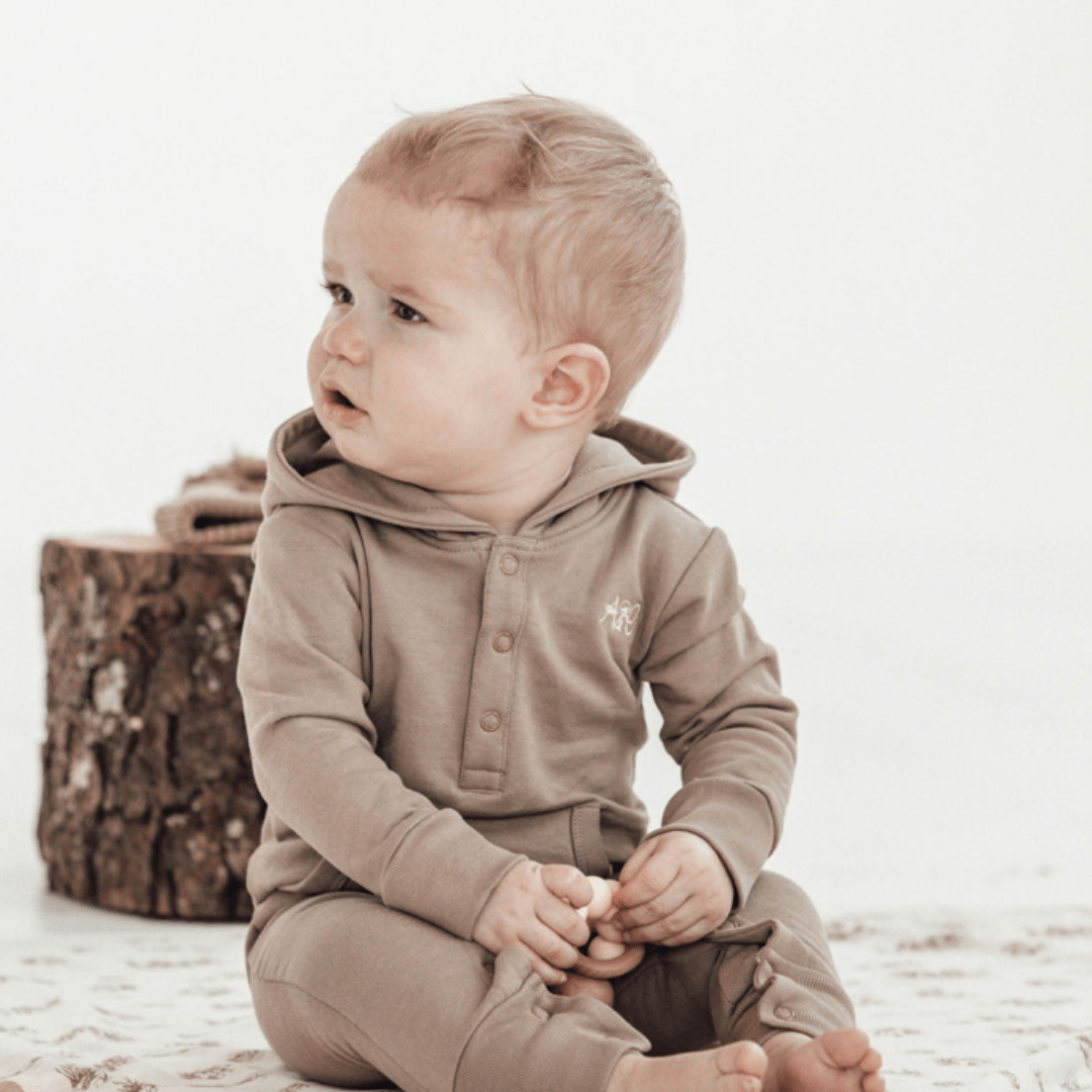 Little-Boy-Wearing-Aster-And-Oak-Organic-Cotton-Bear-Romper-Timber-Naked-Baby-Eco-Boutique
