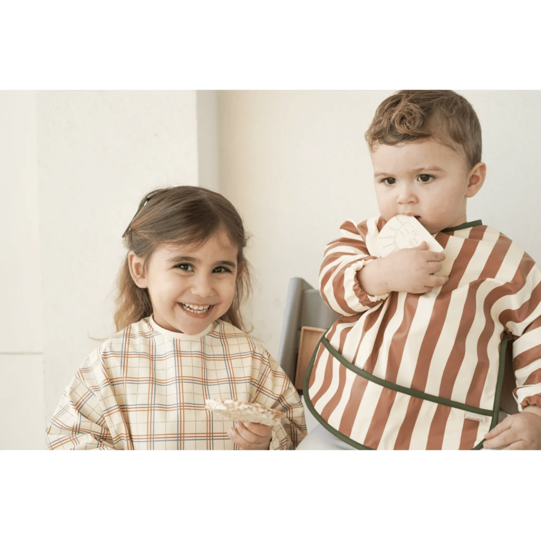 Little-Boy-Wearing-Grech-And-Co-Recycled-Smock-Bib-Stripes-Atlas-And-Tierra-Naked-Baby-Eco-Boutique