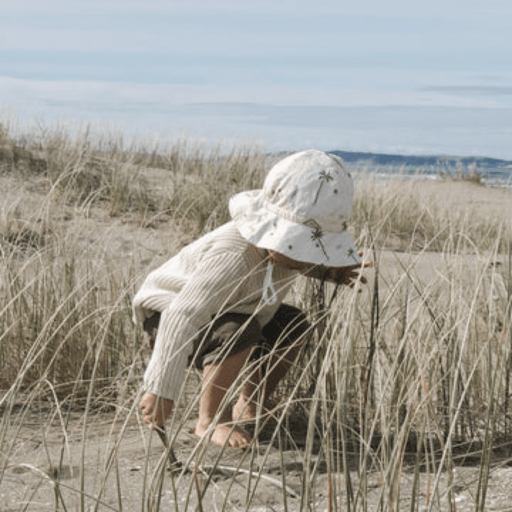 Little-Boy-Wearing-Lola-And-Me-Linen-Sunhat-At-The-Beach-Naked-Baby-Eco-Boutique