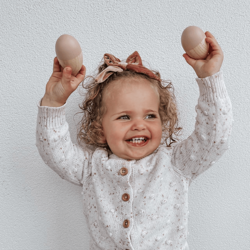 Little-Girl-Laughing-and-Shaking-Funny-Bunny-Kids-Wooden-Egg-Shakers-French-Rose-Naked-Baby-Eco-Boutique