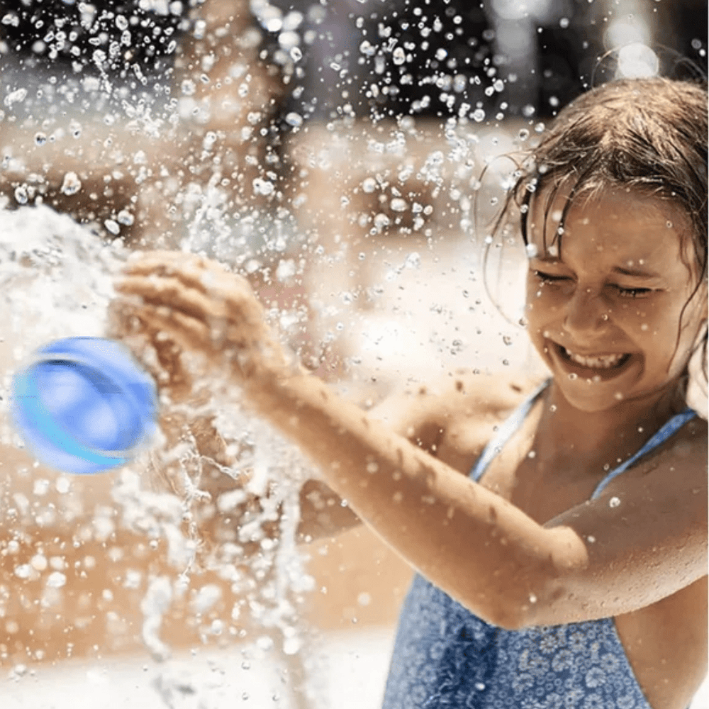 Little-Girl-Playing-Splash-Magnetic-Reusable-Water-Balloons-Naked-Baby-Eco-Boutique