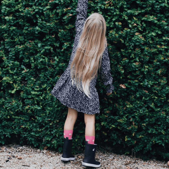 Little-Girl-Reaching-Wearing-Lamington-Merino-Wool-Crew-Child-Socks-Pippa-Naked-Baby-Eco-Boutique