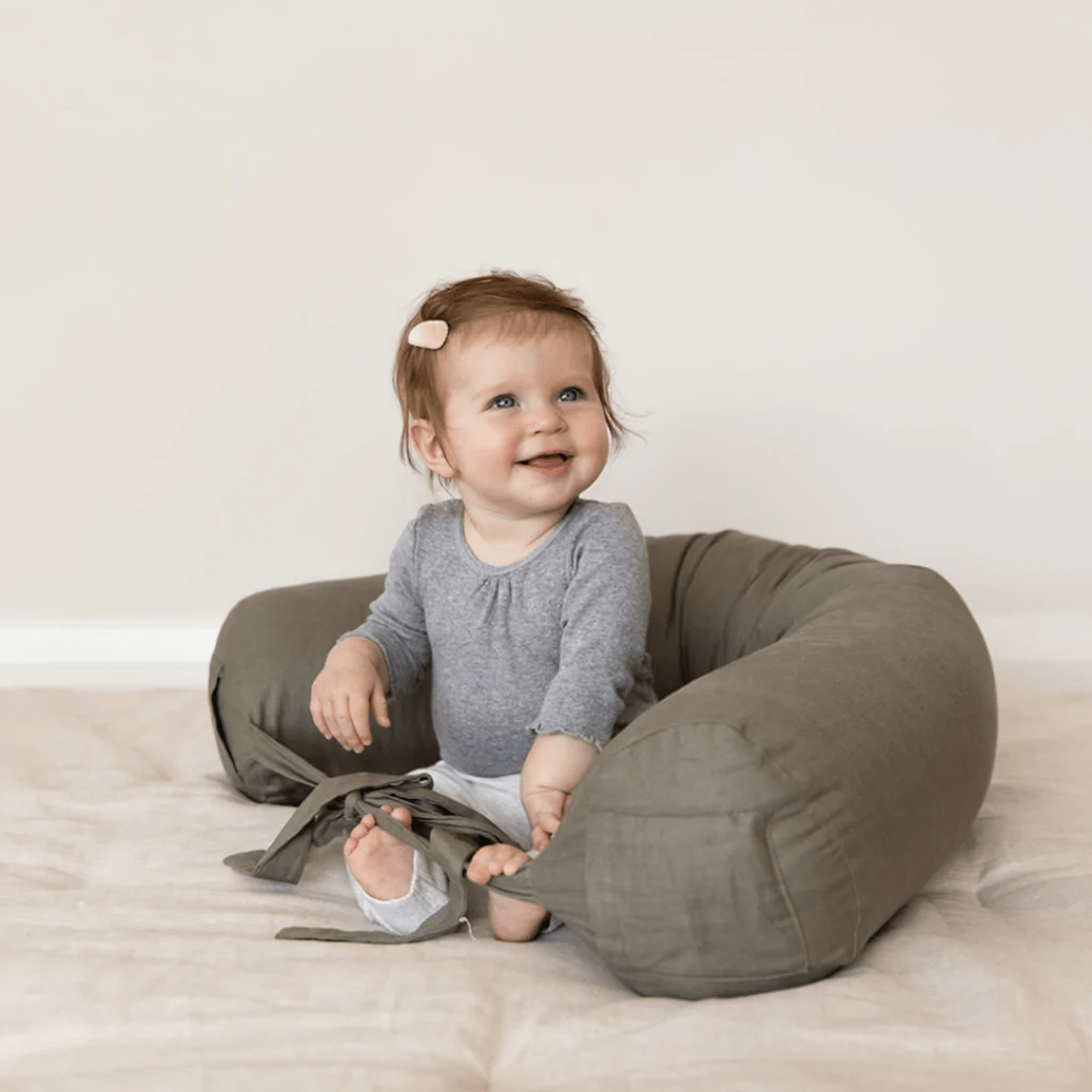 Little-Girl-Sitting-New-Edition-Memory-Foam-And-Linen-Pregnancy-And-Breastfeeding-Pillow-Olive-Naked-Baby-Eco-Boutique