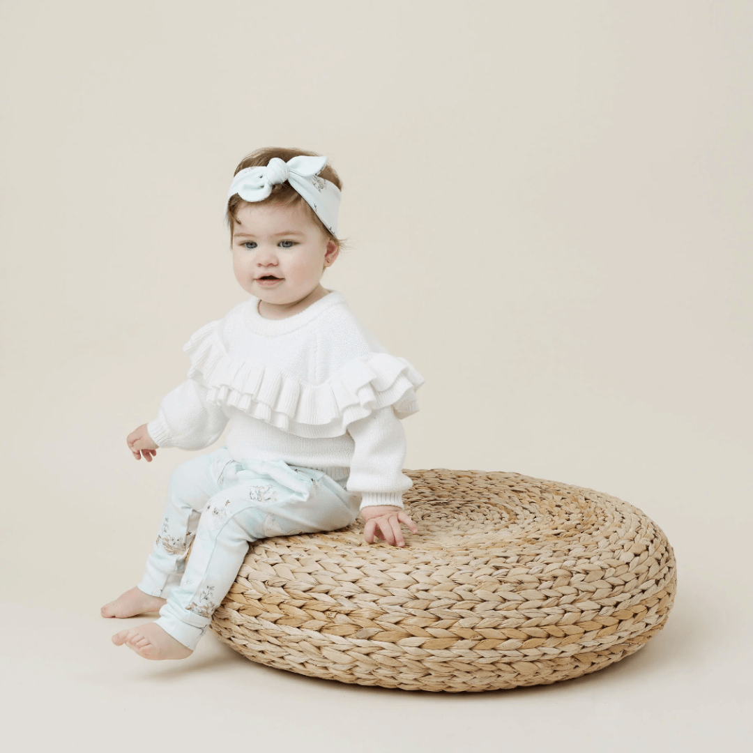 Little-Girl-Sitting-on-Stool-Wearing-Aster-and-Oak-Organic-Cotton-Harem-Pants-Swan-Naked-Baby-Eco-Boutique