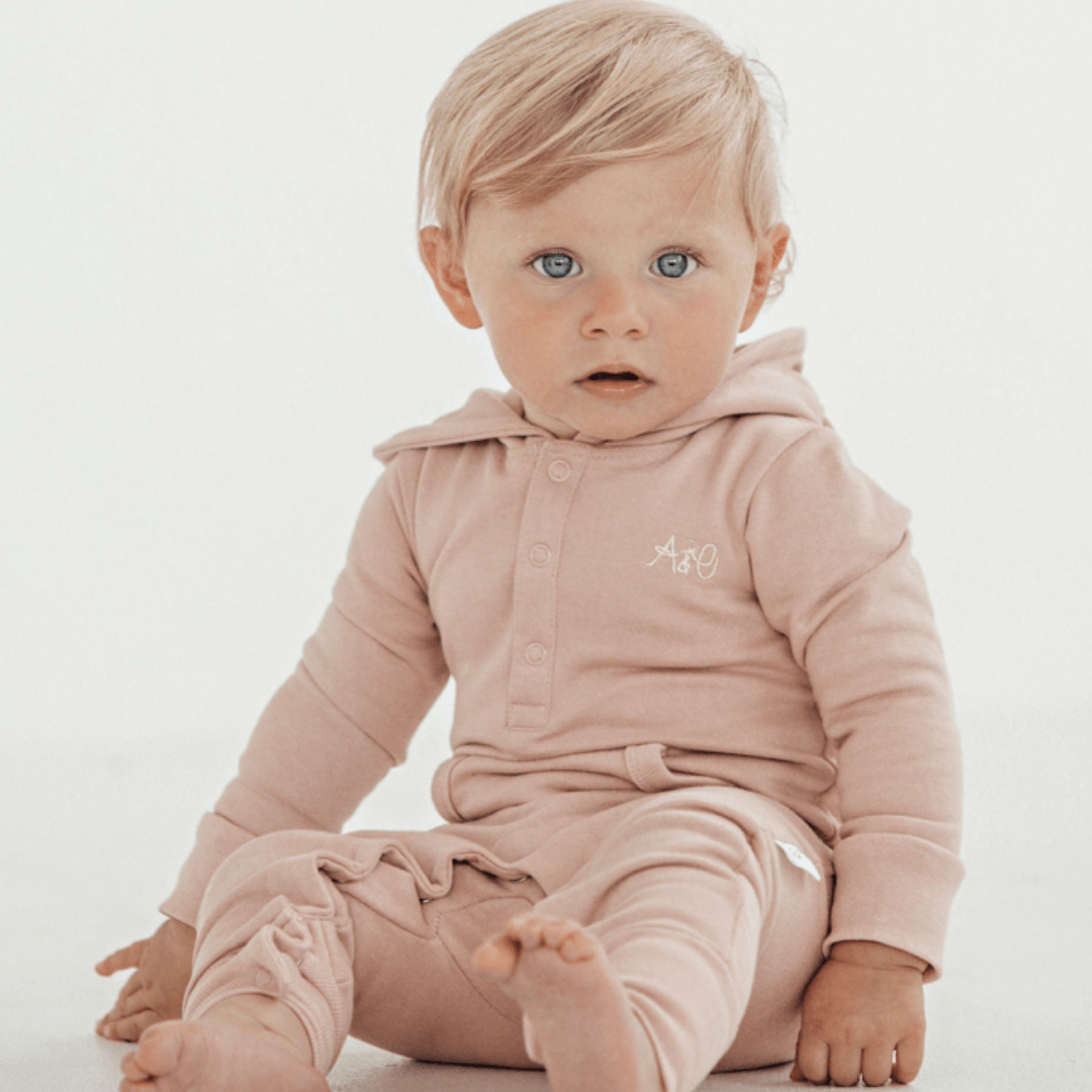 Little-Girl-Wearing-Aster-And-Oak-Organic-Cotton-Bear-Romper-Pink-Naked-Baby-Eco-Boutique