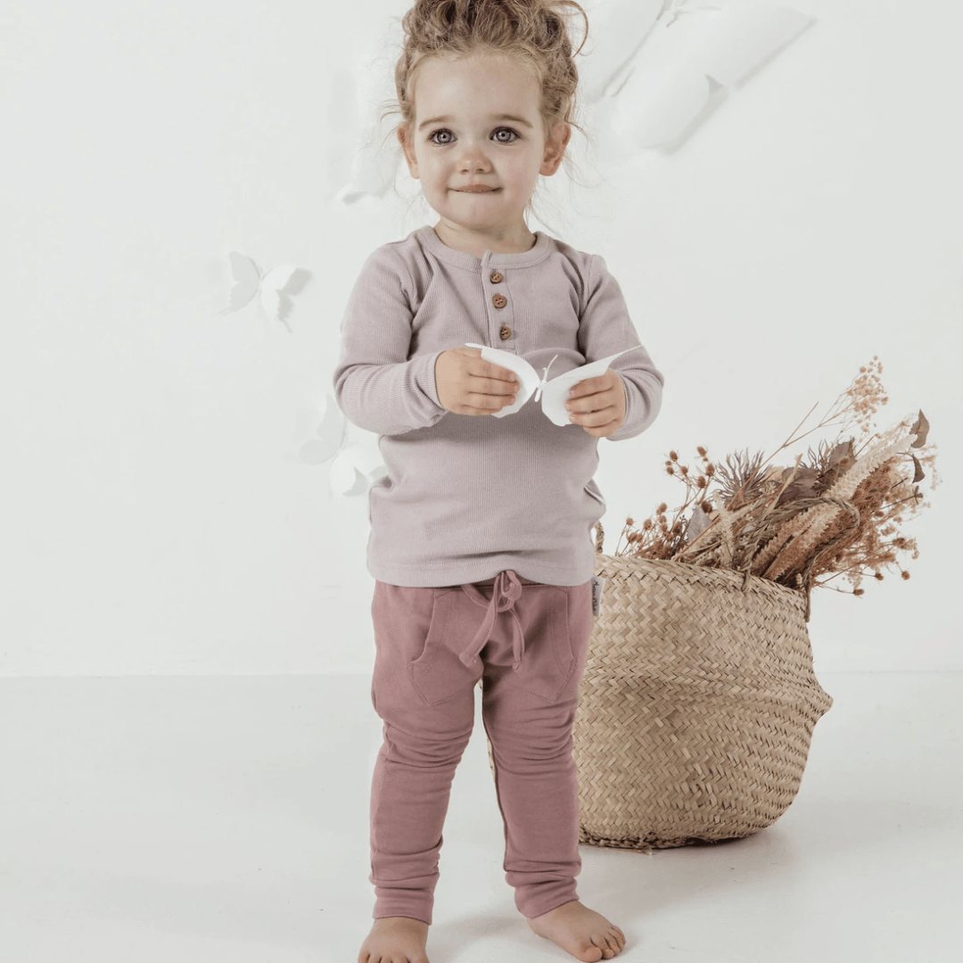 Little-Girl-Wearing-Aster-And-Oak-Organic-Cotton-Jogger-Pants-Berry-Naked-Baby-Eco-Boutique