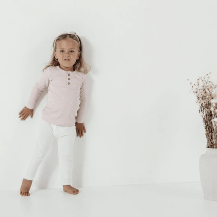 Little-Girl-Wearing-Aster-And-Oak-Organic-Cotton-Rib-Leggings-Snow-Naked-Baby-Eco-Boutique