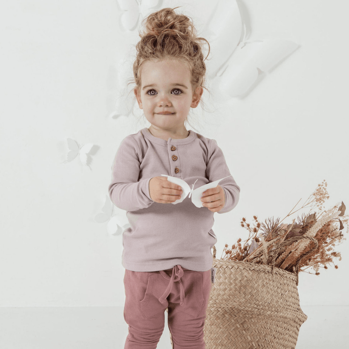 Little-Girl-Wearing-Aster-and-Oak-Organic-Rib-Henley-Top-Violet-Naked-Baby-Eco-Boutique
