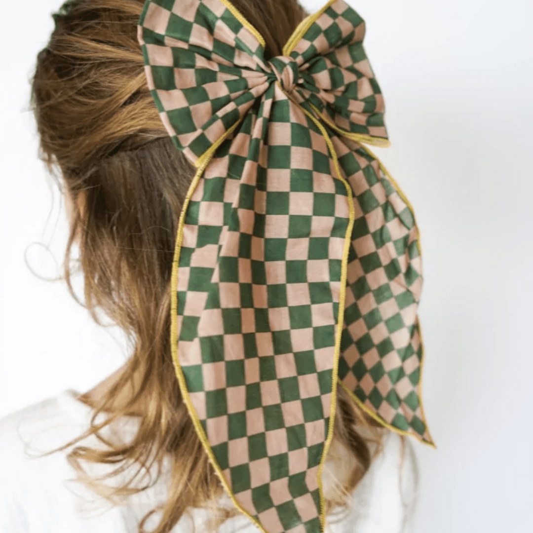 Little-Girl-Wearing-Grech-And-Co-Organic-Cotton-Hair-Bow-Checks-Sunset-And-Orchard-Naked-Baby-Eco-Boutique
