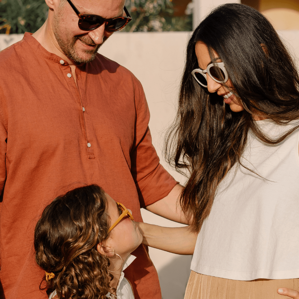 Mum-and-Dad-Looking-at-Daughter-Wearing-Grech-and-Co-Sustainable-Polarised-Sunglasses-Naked-Baby-Eco-Boutique