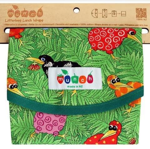 Colorful children's Munch Reusable Lunch Wrap with animal and nature print, featuring a green velcro strap and a "munch" logo.