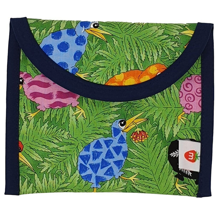 A waterproof green Munch Reusable Lunch Bags - LUCKY LAST - KIWI with colorful birds on it.