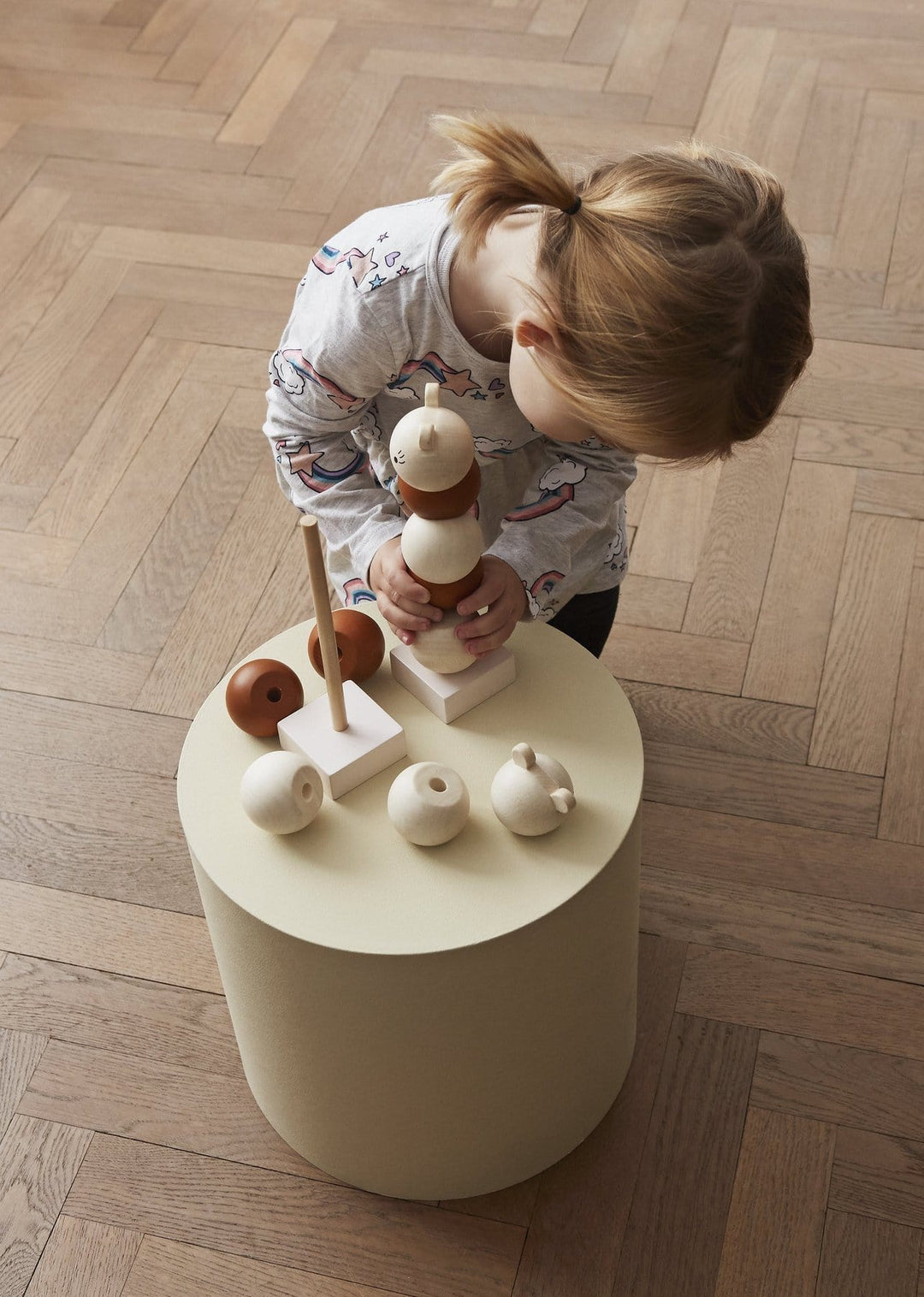 Little-Girl-Stacking-OYOY-Mini-Wooden-Stacker-Lala-Naked-Baby-Eco-Boutique