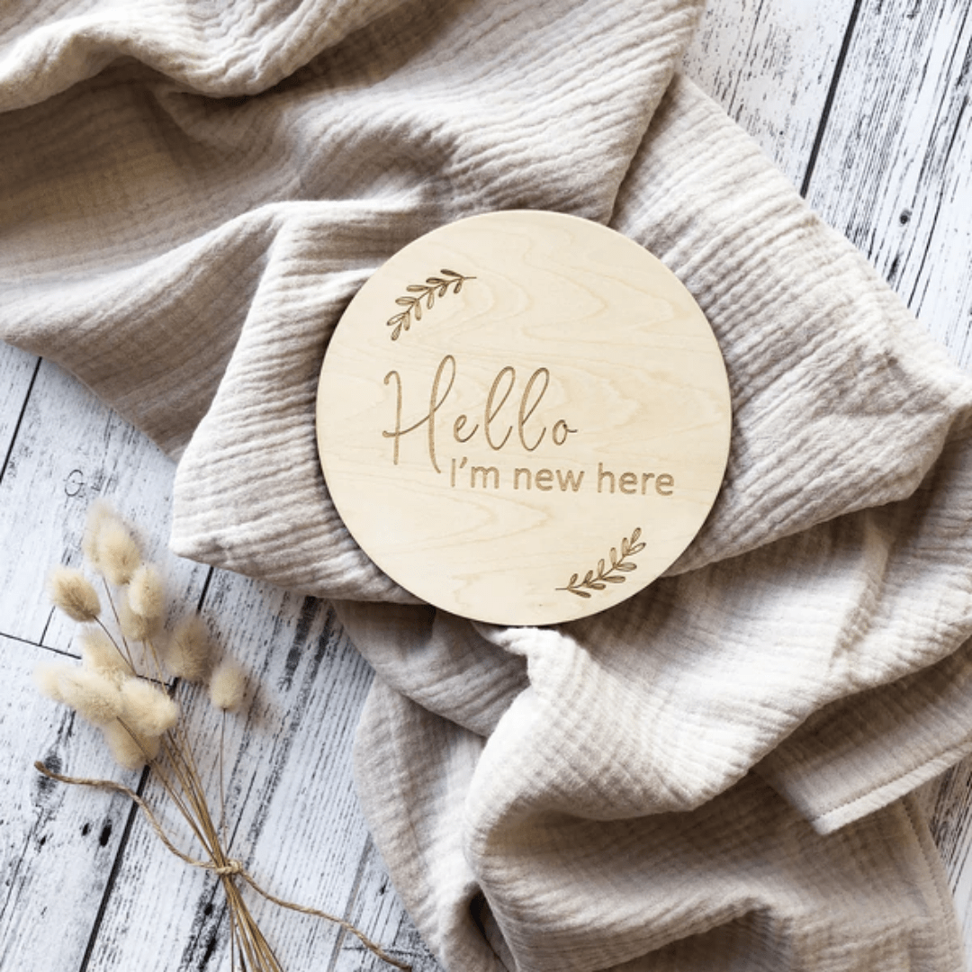 Over-The-Dandelions-Announcement-Plaque-Hello-Im-New-Here-Flatlay-Naked-Baby-Eco-Boutique