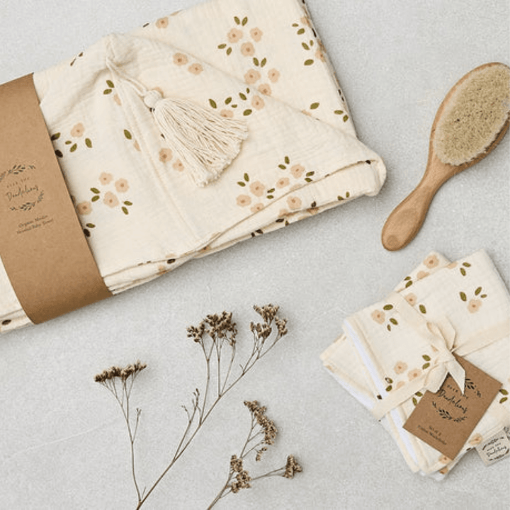 Over-The-Dandelions-Organic-Muslin-Hooded-Towel-Daisy-Print-Flatlay-Naked-Baby-Eco-Boutique