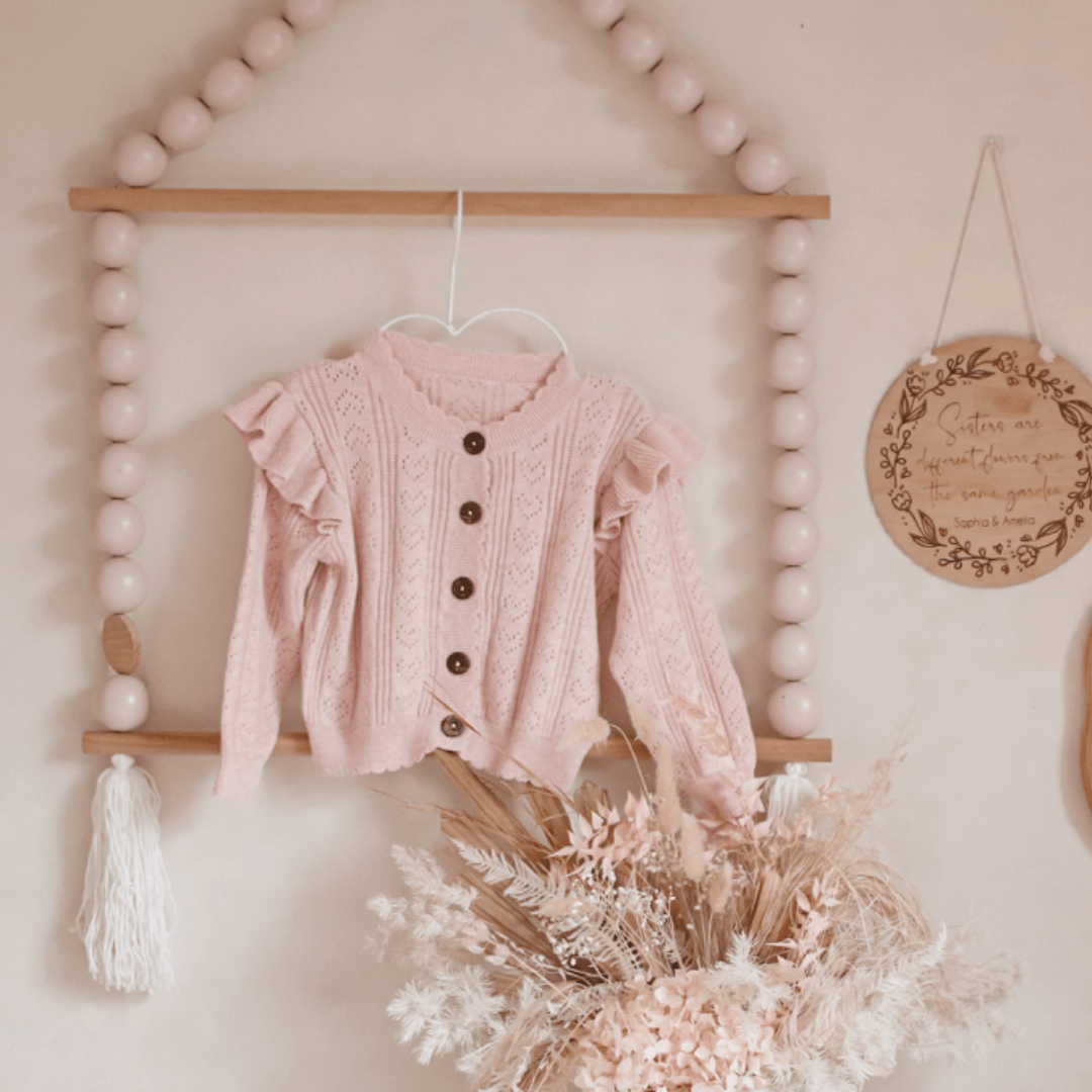 Pic-of-Knit-Hanging-In-Bedroom-Aster-And-Oak-Organic-Ruffle-Knit-Cardigan-Pink-Naked-Baby-Eco-Boutique