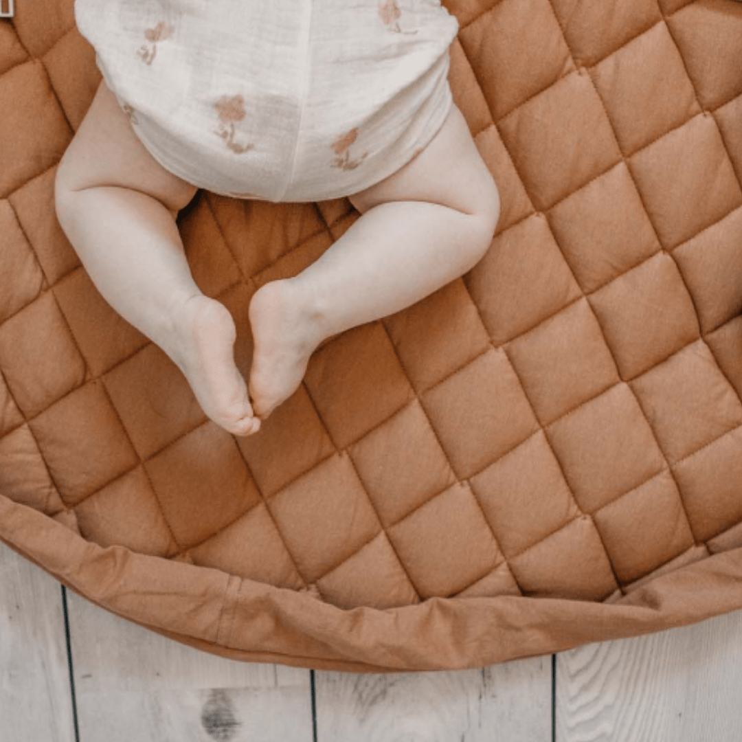 Play-And-Go-Organic-Baby-Playmat-And-Storage-Bag-Tawny-Brown-With-Little-Baby-Feet-Naked-Baby-Eco-Boutique
