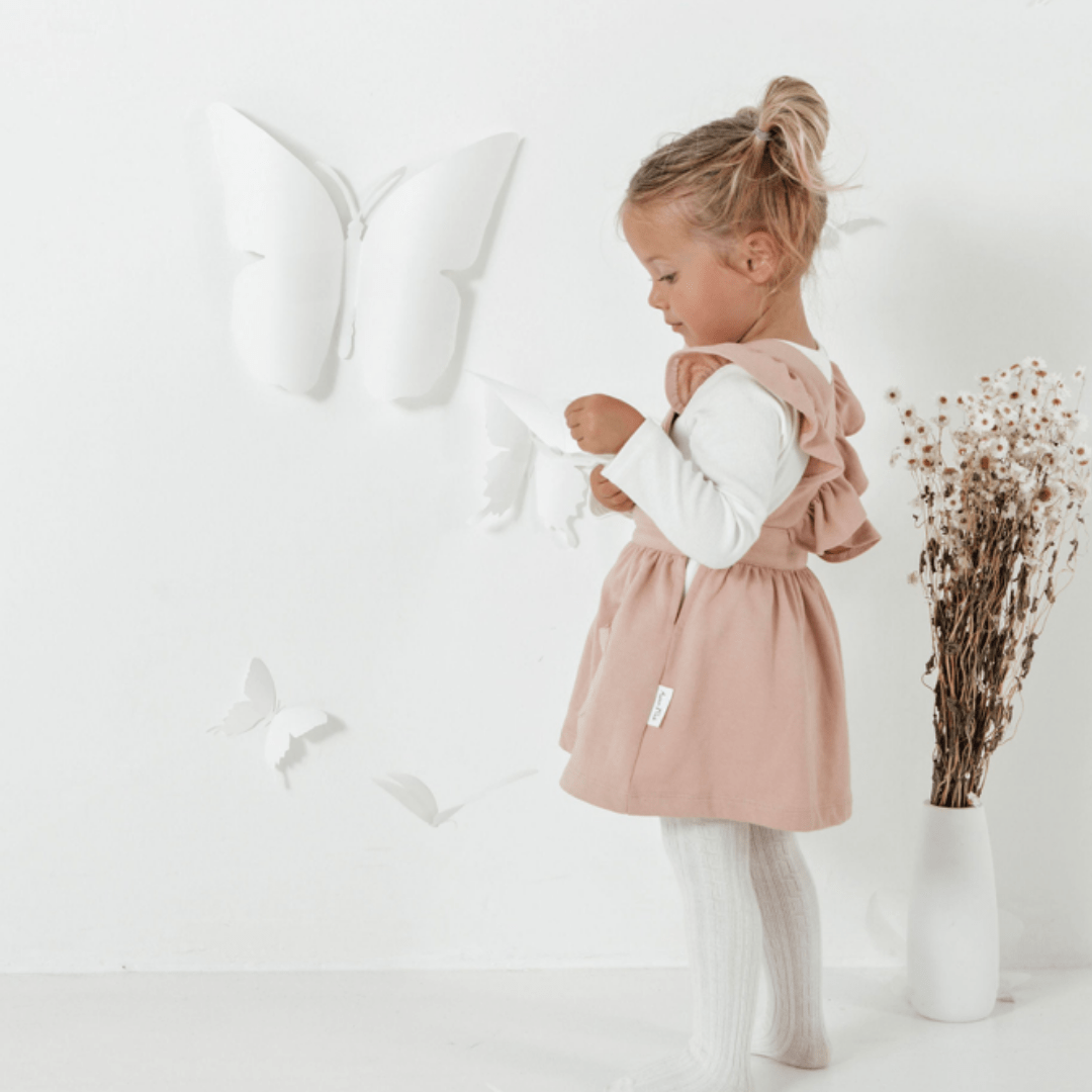 Side-View-Of-Aster-And-Oak-Organic-Song-Bird-Embroidered-Pinafore-Dress-Naked-Baby-Eco-Boutique