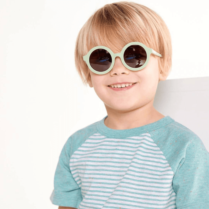 Smiling-Boy-Wearing-Babiators-Euro-Round-Baby-Kids-Sunglasses-All-the-Rage-Sage-Naked-Baby-Eco-Boutique