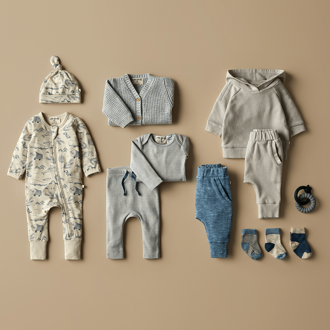 Styled-Flatlay-Of-Wilson-And-Frenchy-Organic-Baby-Pyjamas-Arctic-Blast-With-Knits-And-Leggings-Naked-Baby-Eco-Boutique