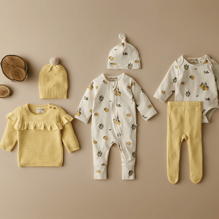 Styled-Flatlay-with-Wilson-and-Frenchy-Knitted-Ruffle-Jumper-Pastel-Yellow-and-Lovely-Lemons-Naked-Baby-Eco-Boutique