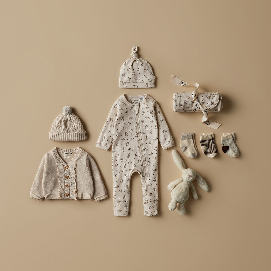 Styled-Flatlay-with-Wilson-and-Frenchy-Pointelle-Baby-Pyjamas-Beanie-and-Knits-Bunny-Love-Naked-Baby-Eco-Boutique