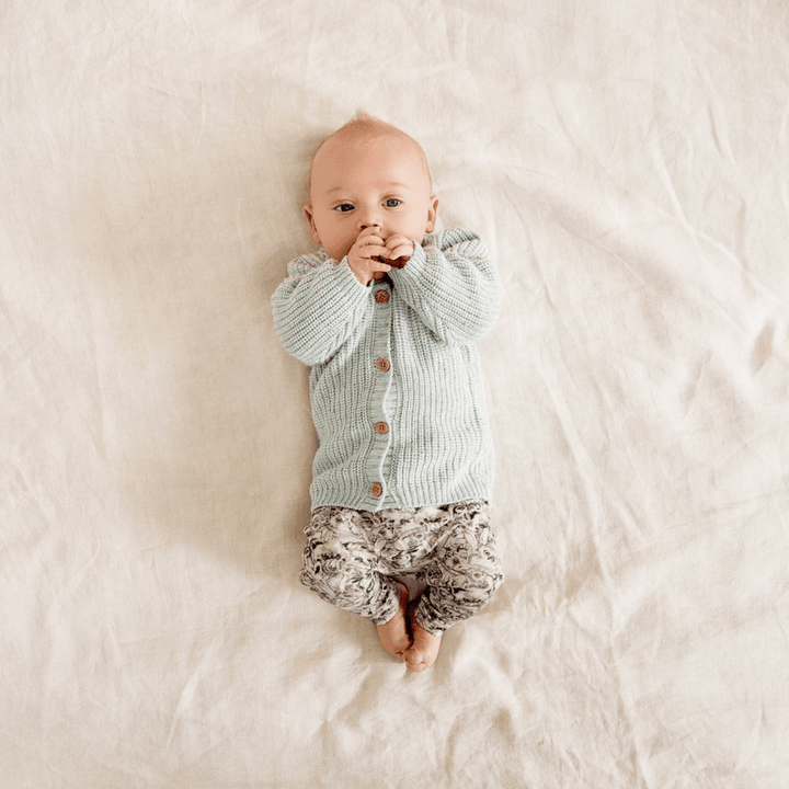 Tiny-Baby-Sucking-Thumb-Wearing-Wilson-and-Frenchy-Knitted-Button-Cardigan-Mint-Naked-Baby-Eco-Boutique