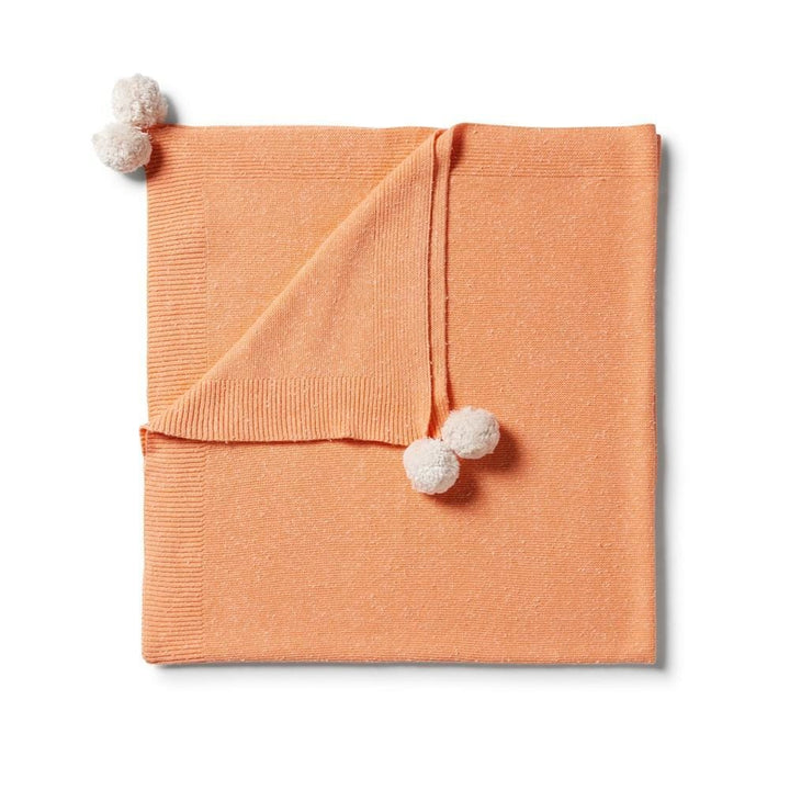 Wilson-and-Frenchy-Knitted-Baby-Blanket-Apricot-Fleck-Folded-View-Naked-Baby-Eco-Boutique