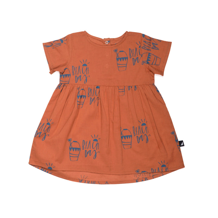 An Anarkid Organic Cotton Beach Day Woven Dress - LUCKY LAST - 0-3 MONTHS ONLY for a baby girl with orange and blue designs, perfect for a Beach Day.