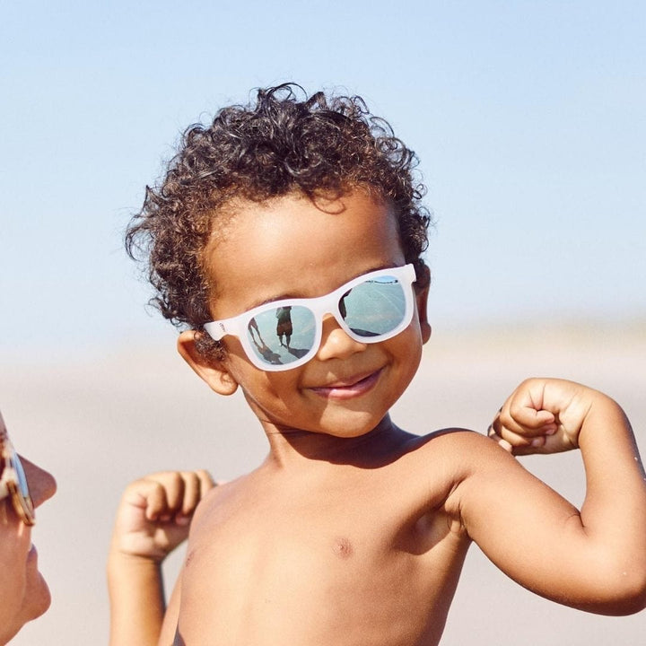 Little-Boy-Showing-Off-Muscles-Wearing-Babiators-Polarized-Navigators-Baby-Kids-Sunglasses-The-Icebreaker-Naked-Baby-Eco-Boutique