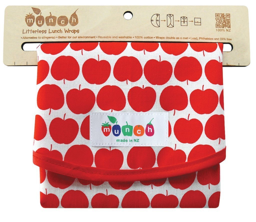 Munch Reusable Lunch Wrap with an apple pattern design, secured with velcro and labeled 'munch, made in nz'. A sustainable and eco-friendly gift for lunch.